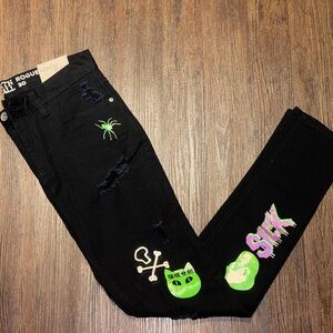 Zumiez Black Jeans with Green and Purple Graphic Design
